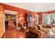 Spacious living room with hardwood floors, a fireplace, and access to the dining room at 643 Longstreet Dr, Marietta, GA 30064