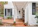 This backyard has a brick patio, covered porch and mature landscaping at 643 Longstreet Dr, Marietta, GA 30064