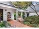 This backyard has a brick patio, covered porch and mature landscaping at 643 Longstreet Dr, Marietta, GA 30064