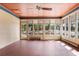 Bright sunroom with brick flooring, paneled walls, and large windows offering natural light at 643 Longstreet Dr, Marietta, GA 30064