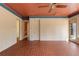 Sunroom features brick floors, white painted brick walls, unique colored ceiling and backyard access at 643 Longstreet Dr, Marietta, GA 30064