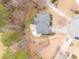 Overhead view of home showcasing the large yard and patio with play structure in a wooded setting at 1203 Bonshaw Trl, Marietta, GA 30064