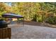 Backyard featuring a stone patio, outdoor grill, gazebo, and playset at 1203 Bonshaw Trl, Marietta, GA 30064