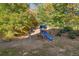 Backyard featuring a playset with swings and a slide at 1203 Bonshaw Trl, Marietta, GA 30064