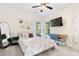 Comfortable bedroom with a large bed, ceiling fan, and modern decor for relaxation at 1203 Bonshaw Trl, Marietta, GA 30064