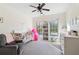 Bedroom features a rocking horse, books, and white trim windows that stream in natural light at 1203 Bonshaw Trl, Marietta, GA 30064