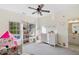 Bedroom features a rocking horse, books, and white trim windows with an attached bath at 1203 Bonshaw Trl, Marietta, GA 30064