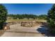 Fire pit with a stone surround and seating area at 1203 Bonshaw Trl, Marietta, GA 30064