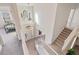 Grand two-story foyer with staircase, chandelier, and ample natural light at 1203 Bonshaw Trl, Marietta, GA 30064