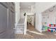Bright, two-story foyer with staircase and a view into other living spaces at 1203 Bonshaw Trl, Marietta, GA 30064