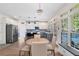 Bright eat-in kitchen featuring stainless steel appliances, a kitchen island, and natural light through the windows at 1203 Bonshaw Trl, Marietta, GA 30064