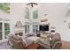 Grand living room boasts soaring ceilings, lots of natural light and a fireplace at 1203 Bonshaw Trl, Marietta, GA 30064