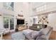 Bright, spacious living room with modern entertainment center and a cozy seating area at 1203 Bonshaw Trl, Marietta, GA 30064