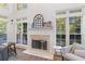 Fireplace with white mantle and hearth surrounded by multiple windows at 1203 Bonshaw Trl, Marietta, GA 30064