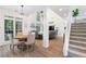 Spacious living area with soaring ceilings, many windows, a fireplace, and a staircase at 1203 Bonshaw Trl, Marietta, GA 30064