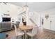 Open-concept living space featuring a comfortable seating area, a staircase, and a dining area at 1203 Bonshaw Trl, Marietta, GA 30064