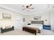 Spacious primary bedroom with tray ceiling and large windows that stream in natural light with ensuite at 1203 Bonshaw Trl, Marietta, GA 30064