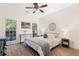 A serene main bedroom with hardwood floors, bright windows, and a calming neutral color palette at 1203 Bonshaw Trl, Marietta, GA 30064