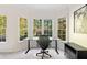 Bright office space with a large window, desk, chair, and storage; perfect for remote work or study at 1203 Bonshaw Trl, Marietta, GA 30064