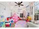 Bright and cheery playroom featuring a play tent, chalkboard, and plenty of space for toys and imagination at 1203 Bonshaw Trl, Marietta, GA 30064