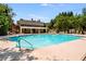 Community pool featuring a bath house, chairs, tables, and a lounging area at 1203 Bonshaw Trl, Marietta, GA 30064