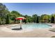 Community pool area featuring lounge chairs and a mushroom-shaped water feature at 1203 Bonshaw Trl, Marietta, GA 30064