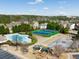 Aerial view of community amenities including a pool, tennis courts, and playground at 218 Highgrove Way, Dallas, GA 30157