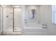 Bathroom featuring a separate shower and tub at 218 Highgrove Way, Dallas, GA 30157
