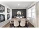 Elegant dining room highlighted by a modern light fixture, sleek floors, and stylish leaf wall art at 218 Highgrove Way, Dallas, GA 30157