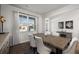 Well-lit dining area features neutral walls, large window, stylish decor, and wood flooring at 218 Highgrove Way, Dallas, GA 30157