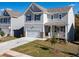 Modern two-story home featuring a front porch, attached garage, and manicured front lawn at 218 Highgrove Way, Dallas, GA 30157