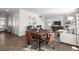 An open-concept living space includes dining area, comfortable seating, and plenty of natural light at 218 Highgrove Way, Dallas, GA 30157