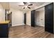 View of finished basement features a dark storage cabinet and sliding barn doors at 490 Revenna Trl, Fayetteville, GA 30214