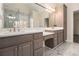 Bathroom with large vanity, dual sinks, and large mirror at 490 Revenna Trl, Fayetteville, GA 30214