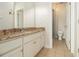 Bathroom with vanity, granite countertop, tile flooring, and glass enclosed shower at 490 Revenna Trl, Fayetteville, GA 30214