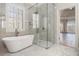 Luxury bathroom features soaking tub and large glass shower at 490 Revenna Trl, Fayetteville, GA 30214