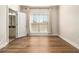 Cozy bedroom with hardwood floors, window, and ensuite bathroom offers natural light at 490 Revenna Trl, Fayetteville, GA 30214