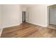 Spacious bedroom boasts beautiful hardwood floors and multiple closets for ample storage at 490 Revenna Trl, Fayetteville, GA 30214