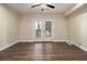 Bedroom features a ceiling fan and french doors with white blinds at 490 Revenna Trl, Fayetteville, GA 30214