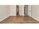Spacious room showcasing beautiful hardwood floors and access to multiple rooms at 490 Revenna Trl, Fayetteville, GA 30214