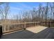 Spacious wooden deck overlooking a serene wooded area, perfect for outdoor entertaining and relaxation at 490 Revenna Trl, Fayetteville, GA 30214