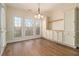 Inviting dining area with hardwood floors, built-in cabinets, and large windows offering natural light at 490 Revenna Trl, Fayetteville, GA 30214