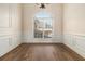 Dining Room with hardwood floors, large window with natural light and wainscotting on walls at 490 Revenna Trl, Fayetteville, GA 30214