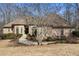 Charming brick home featuring a well-manicured lawn and an inviting entrance walkway at 490 Revenna Trl, Fayetteville, GA 30214