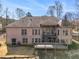 Back of a brick home featuring decks, outdoor space, and well-maintained yard at 490 Revenna Trl, Fayetteville, GA 30214