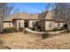 Beautiful brick home with manicured landscaping, attractive architectural details, and a welcoming facade at 490 Revenna Trl, Fayetteville, GA 30214