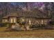 Charming brick home featuring a well-manicured lawn and an inviting entrance walkway at 490 Revenna Trl, Fayetteville, GA 30214