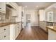 Modern kitchen featuring granite countertops, custom cabinets, stainless steel appliances, and hardwood floors at 490 Revenna Trl, Fayetteville, GA 30214