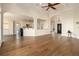 Open living space with hardwood floors, archways, a coffered ceiling and seamless flow to the kitchen at 490 Revenna Trl, Fayetteville, GA 30214