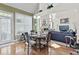 Dining area with hardwood floors and plenty of natural light is conveniently near the living room at 50 Cannonade Ct, Covington, GA 30016